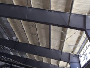 Metal building spray insulation