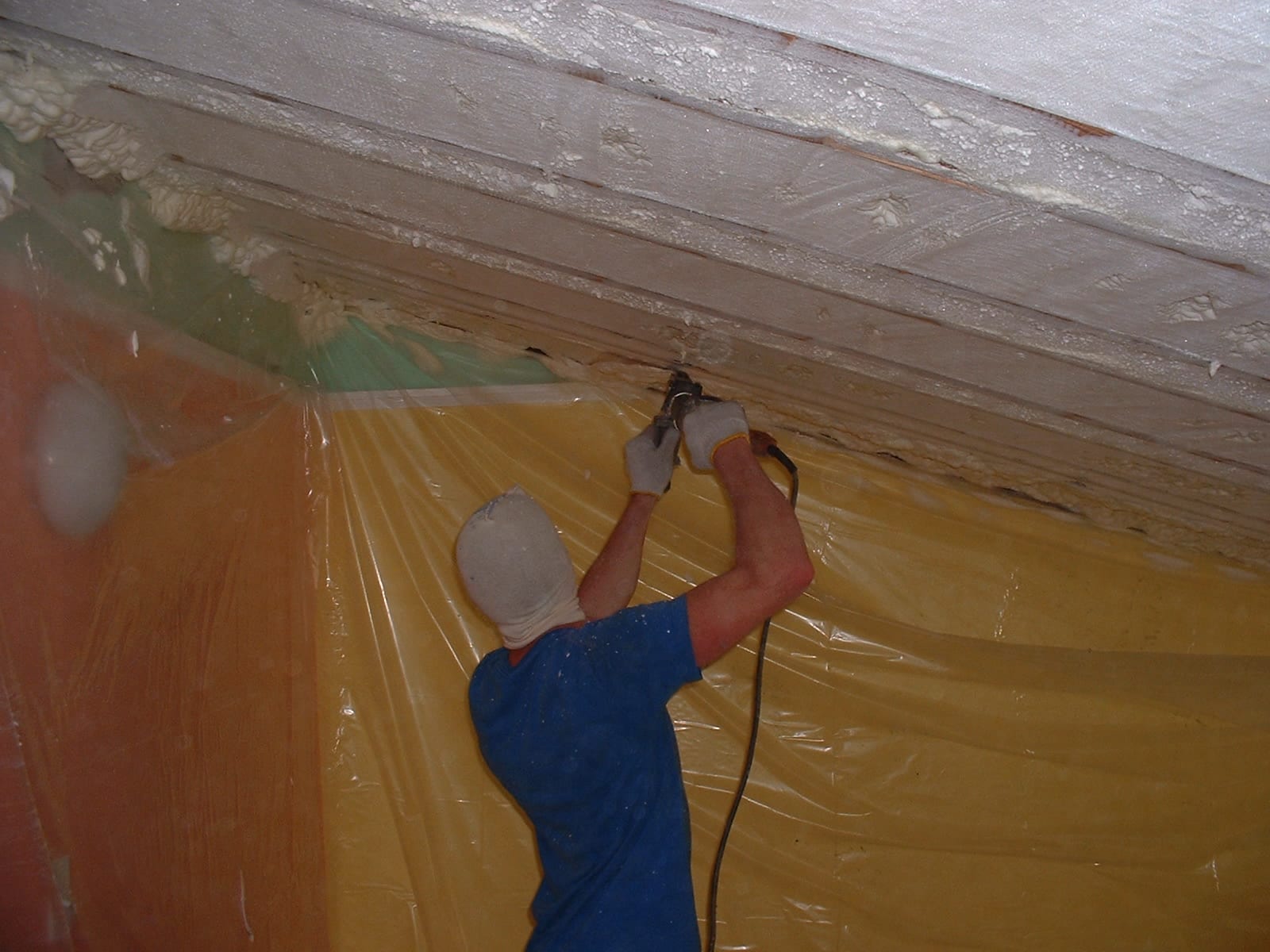 Open cell insulation foam is trimmed overhead.