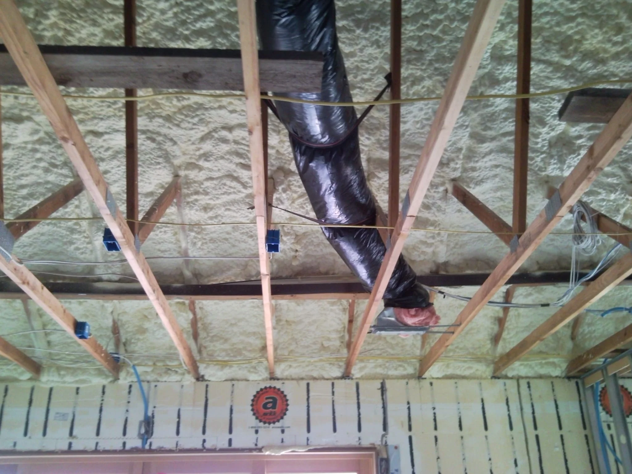 Open attic with spray on foam insulation
